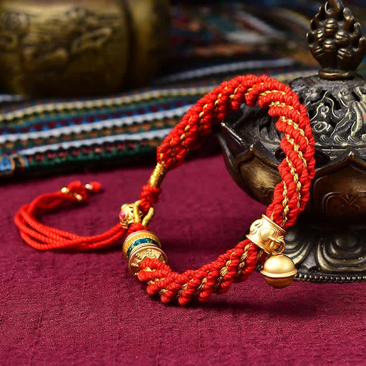 Pulsera de cuerda trenzada con dije de campana y rueda de oración Thangka de protección de la suerte hecha a mano tibetana
