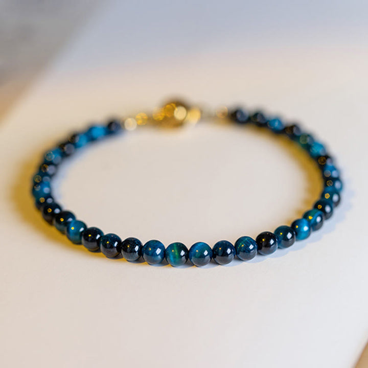Pulsera de cadena de protección con piedra de ojo de tigre azul natural de Buddha Stones