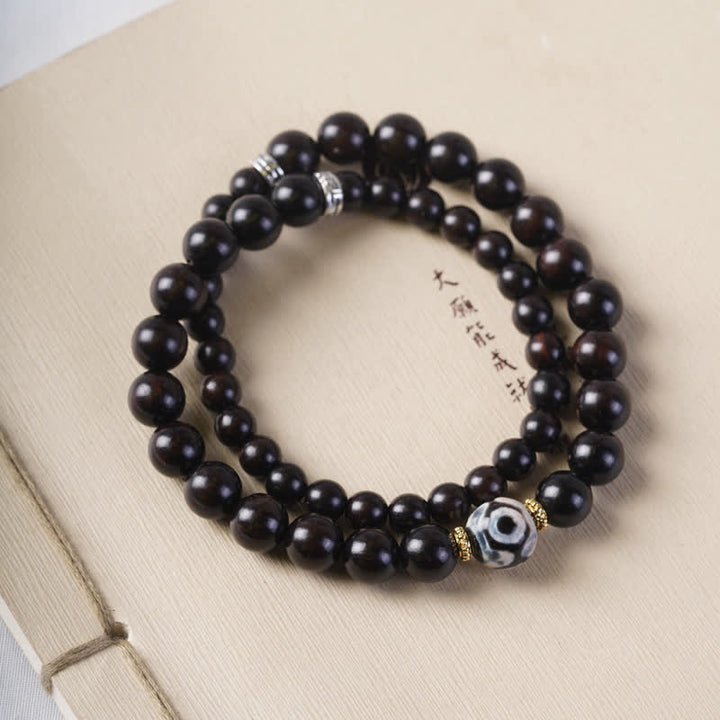 Pulsera de doble envoltura con cuentas Dzi de madera de ébano del Tíbet con Buddha Stones