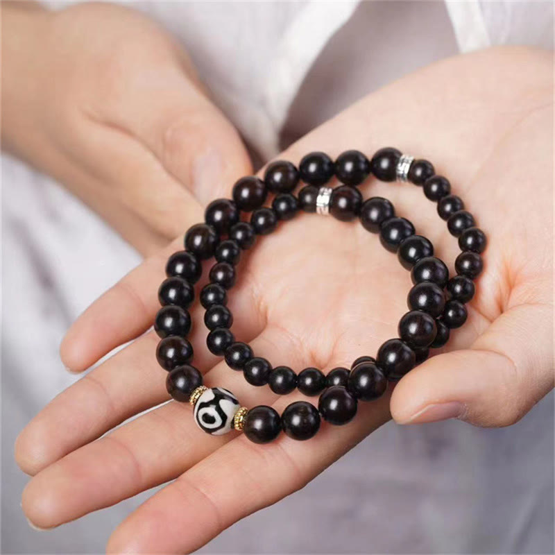 Pulsera de doble envoltura con cuentas Dzi de madera de ébano del Tíbet con Buddha Stones