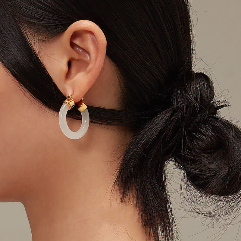 Pendientes de prosperidad de jade blanco redondo de Buddha Stones