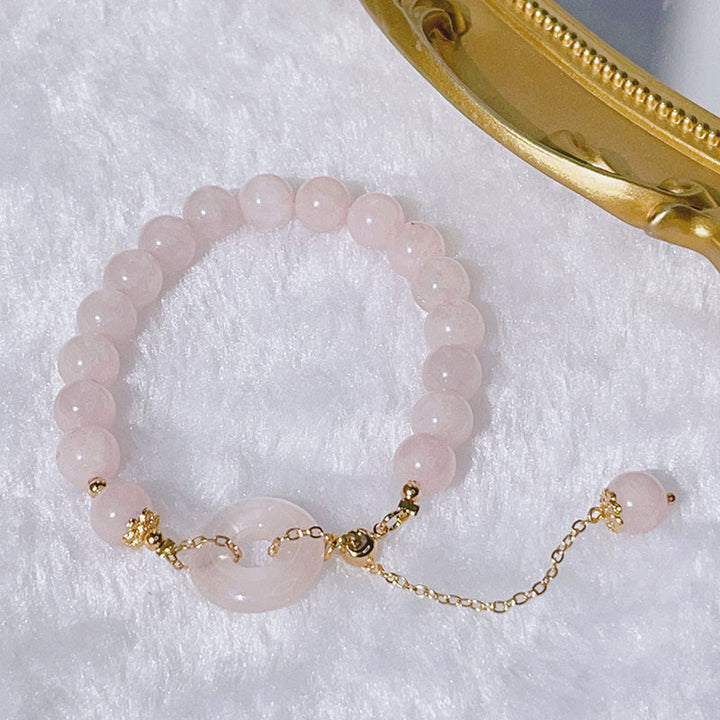 Pulsera con dije de amor con hebilla de paz y cristal rosa natural con Buddha Stones