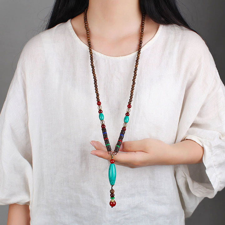 Buddha Stones Madera de wengué Piedra turquesa Protección Calma Collar Colgante