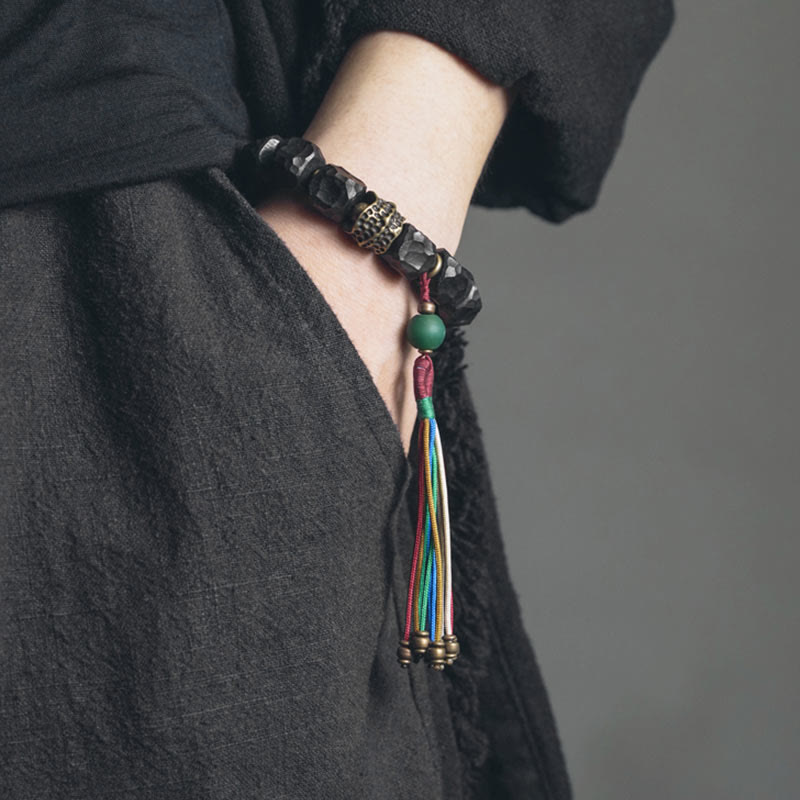 Pulsera Mala de muñeca con borla de paz de cobre y madera de ébano del Tíbet