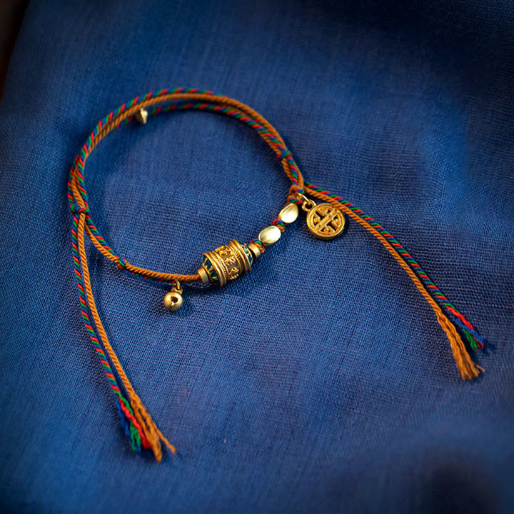 Pulsera de cuerda de fuerza de protección de rueda de oración Om Mani Padme Hum hecha a mano tibetana con Buddha Stones