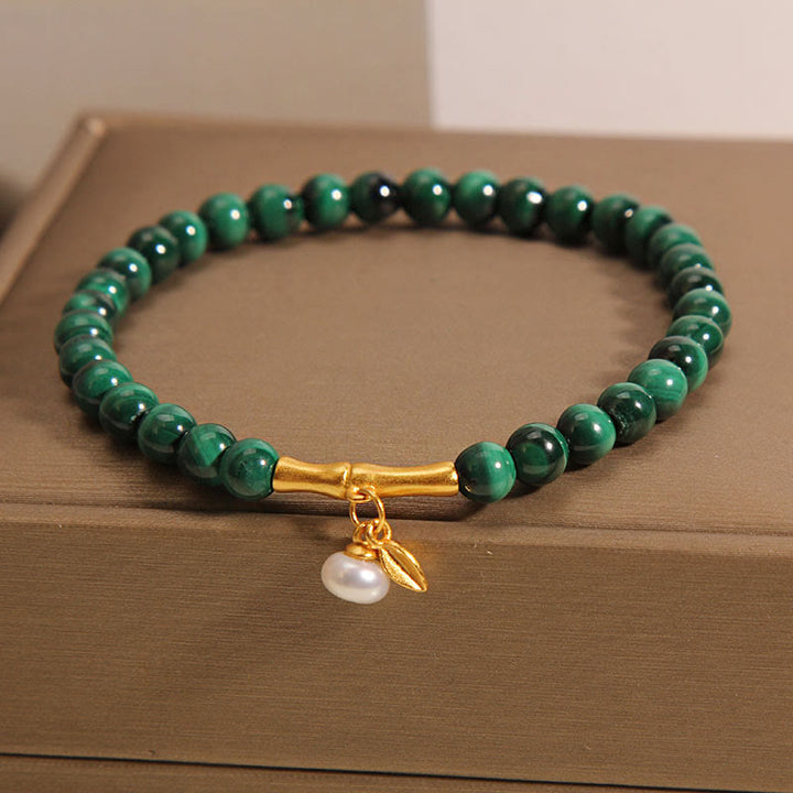 Pulsera antiansiedad de bambú de la suerte con perlas de malaquita natural de Buddha Stones