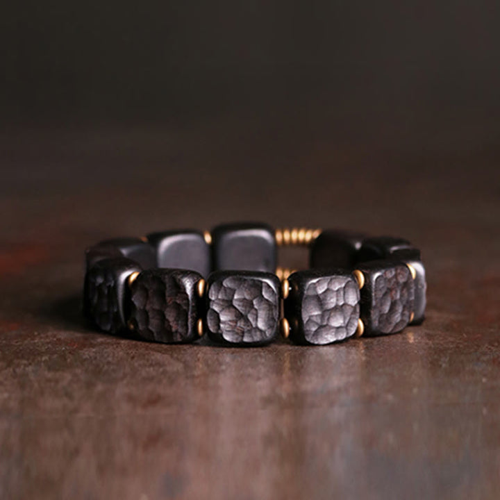 Pulsera de equilibrio de paz de cobre estilo textura de madera de ébano retro con Buddha Stones