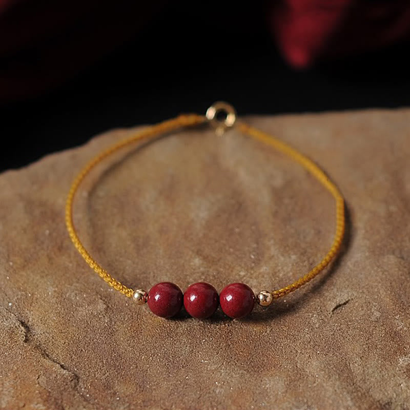 Pulsera trenzada con cadena de bendición de cinabrio natural chapada en oro de 14 quilates con Buddha Stones