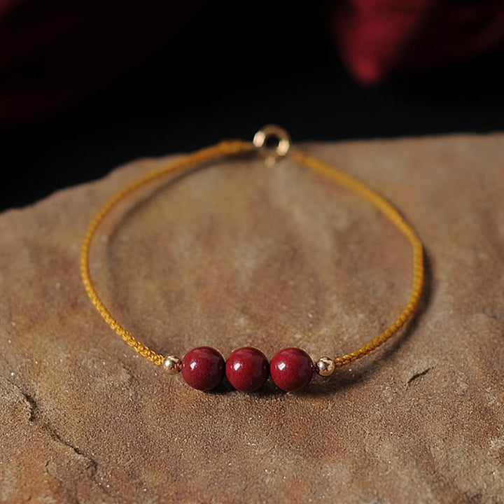 Pulsera trenzada con cadena de bendición de cinabrio natural chapada en oro de 14 quilates con Buddha Stones