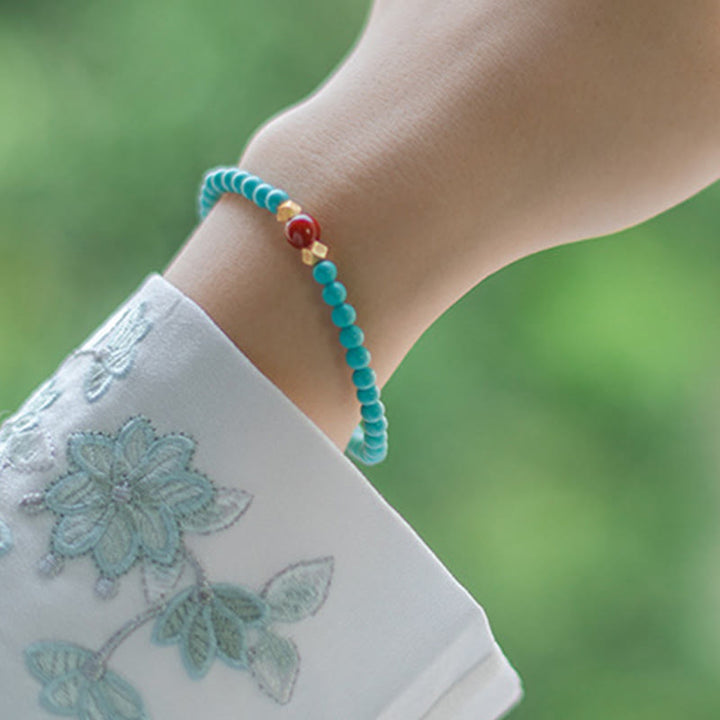 Pulsera de protección con cuentas de ágata roja turquesa de Buddha Stones