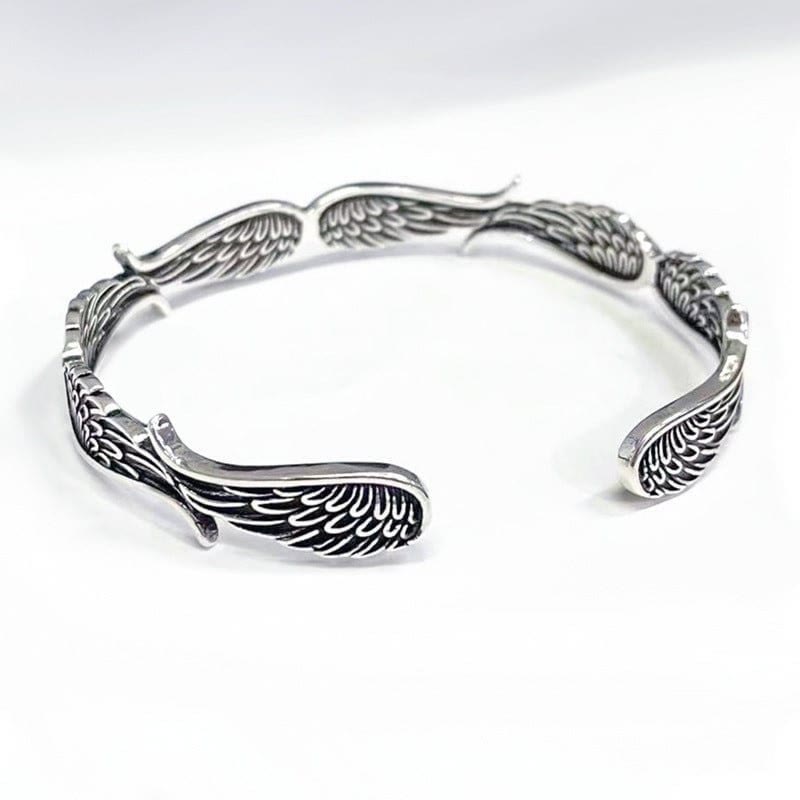 Brazalete de pulsera de la suerte tallada con patrón de plumas de alas de ángel de Buddha Stones