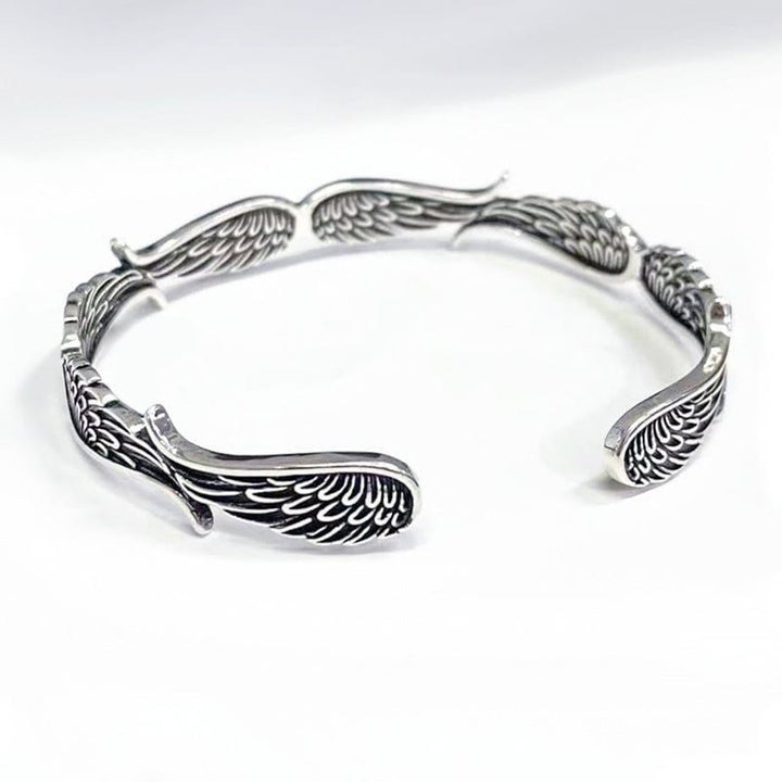 Brazalete de pulsera de la suerte tallada con patrón de plumas de alas de ángel de Buddha Stones