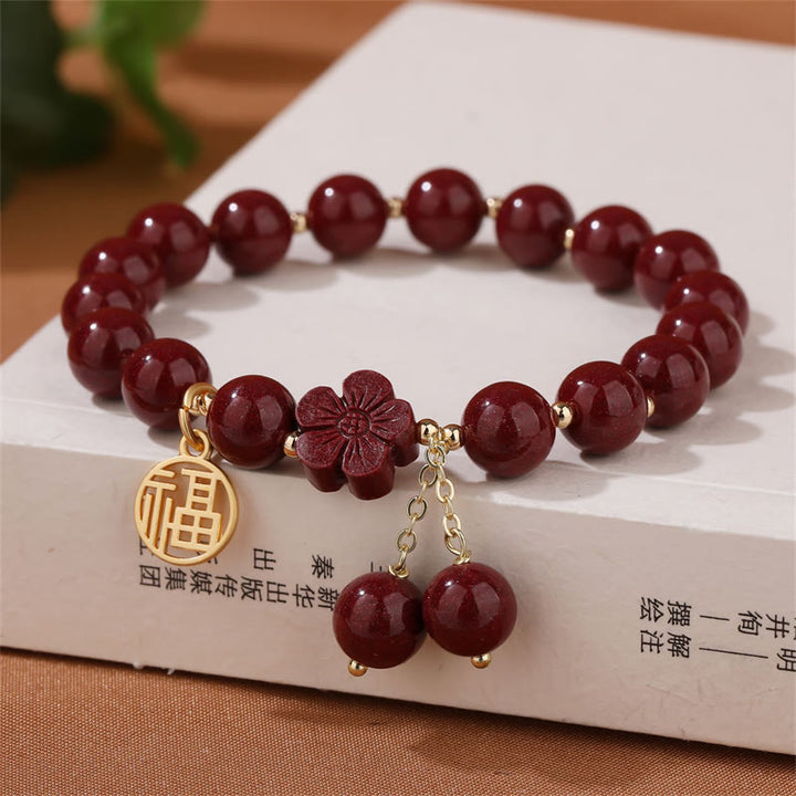 Pulsera de bendición de flor de cerezo con personaje de cinabrio de Buddha Stones