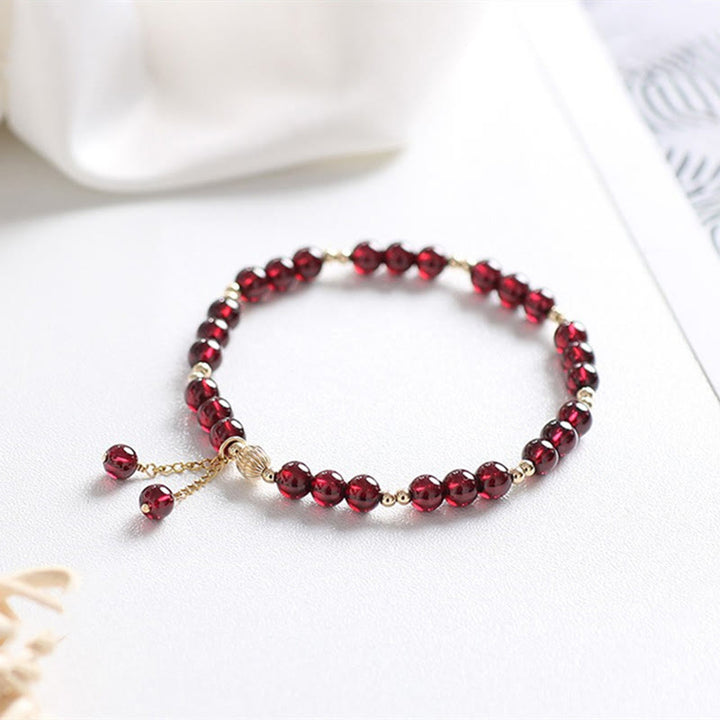 Pulsera Calm de granate natural de oro de 14 quilates con Buddha Stones