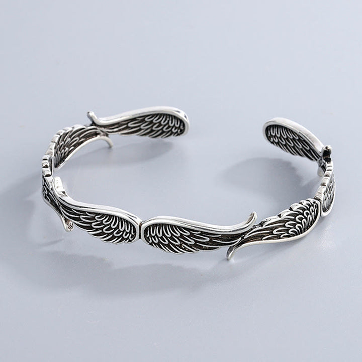 Brazalete de pulsera de la suerte tallada con patrón de plumas de alas de ángel de Buddha Stones