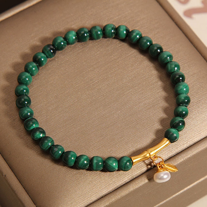 Pulsera antiansiedad de bambú de la suerte con perlas de malaquita natural de Buddha Stones