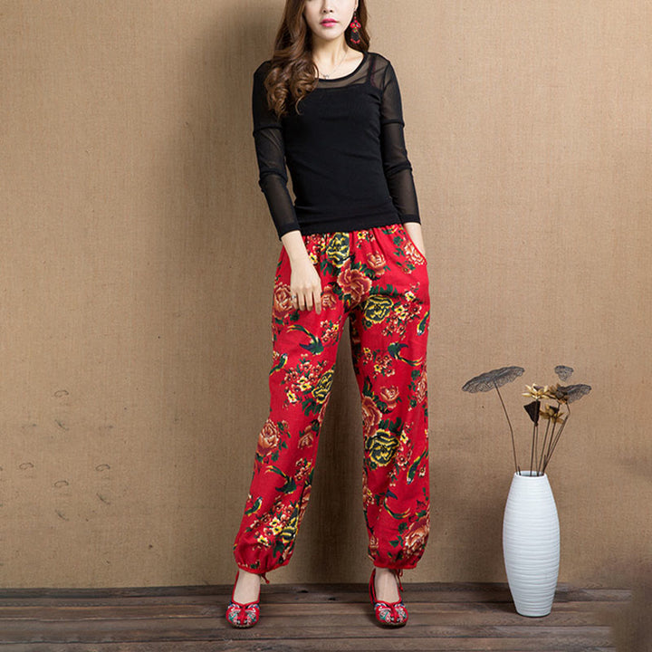 Pantalones bombachos con estampado de flores rojas y verdes de estilo étnico con Buddha Stones y bolsillos