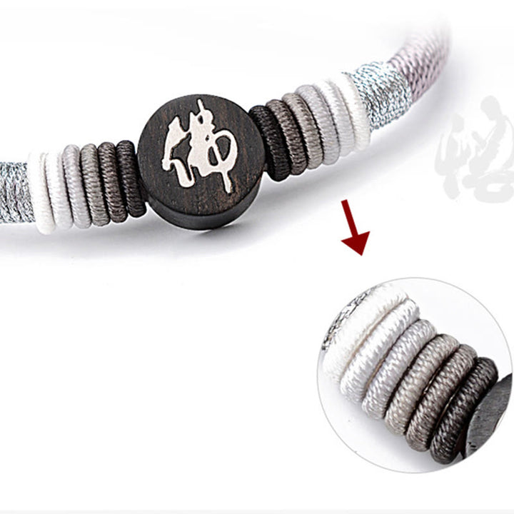 Pulsera de cuerda hecha a mano de ébano con personaje de Buda de Buddha Stones