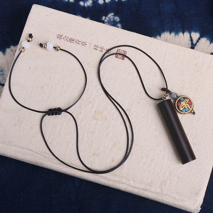 Colgante de collar de paz y calma con cuentas Dzi de madera de ébano tibetano