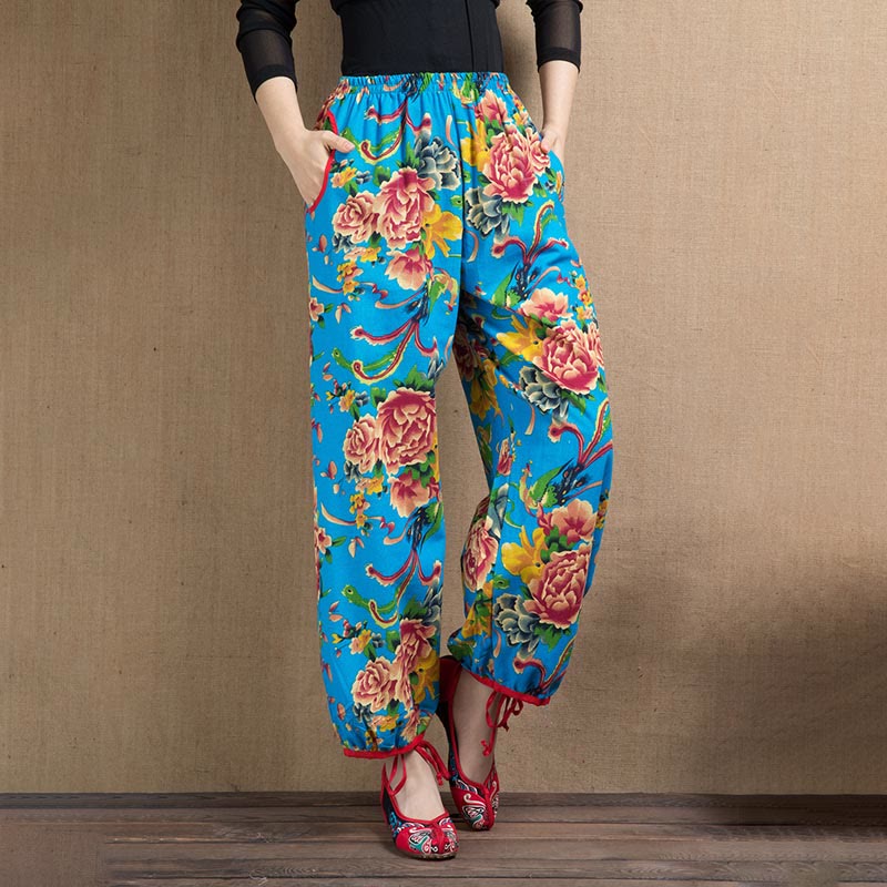Pantalones bombachos con estampado de flores rojas y verdes de estilo étnico con Buddha Stones y bolsillos