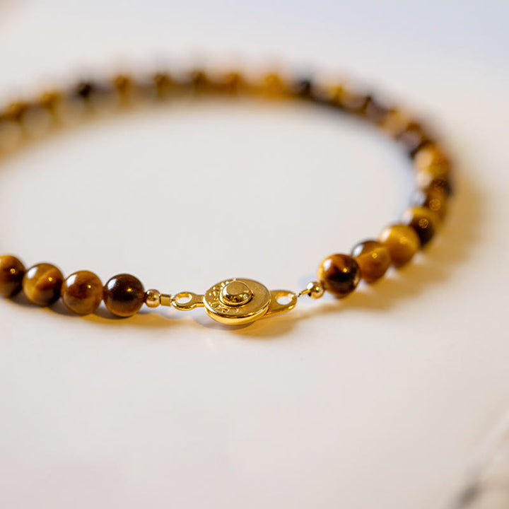 Buddha Stones Pulsera de protección de coraje con piedra de ojo de tigre natural chapada en oro de 14 quilates