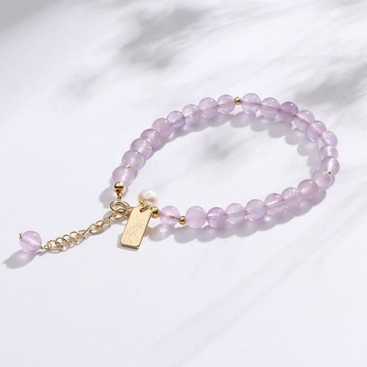 Pulsera de cristal de amatista natural que alivia el estrés.