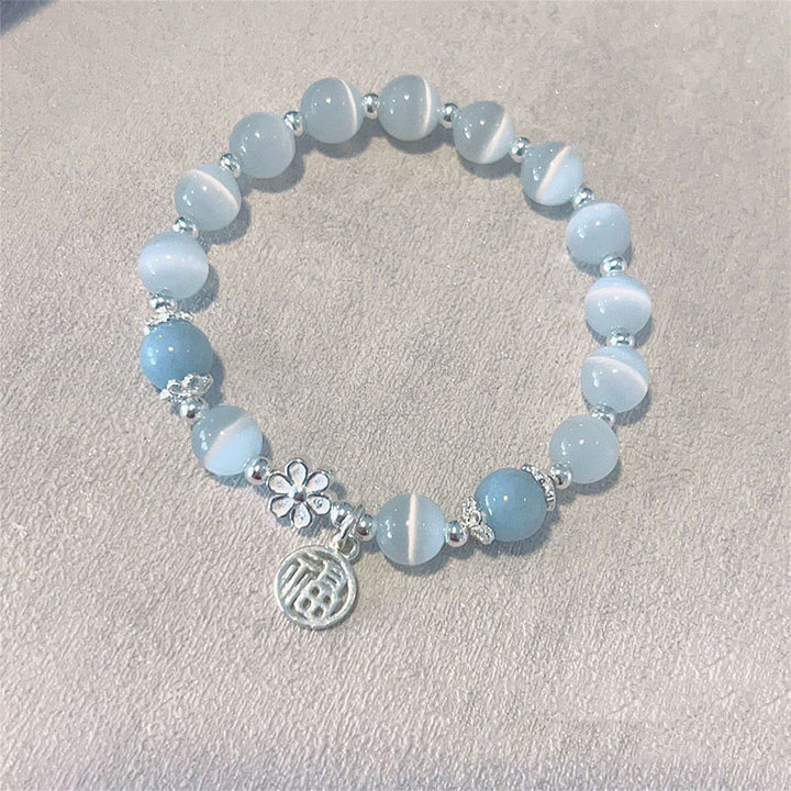 Pulsera de soporte con dije de personaje Fu de campana de flor de melocotón de cristal de ojo de gato con Buddha Stones