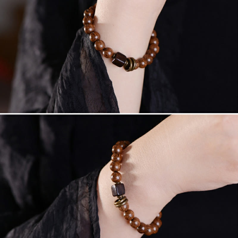 Pulsera de espiritualidad de madera de Phoebe Zhennan con Buddha Stones