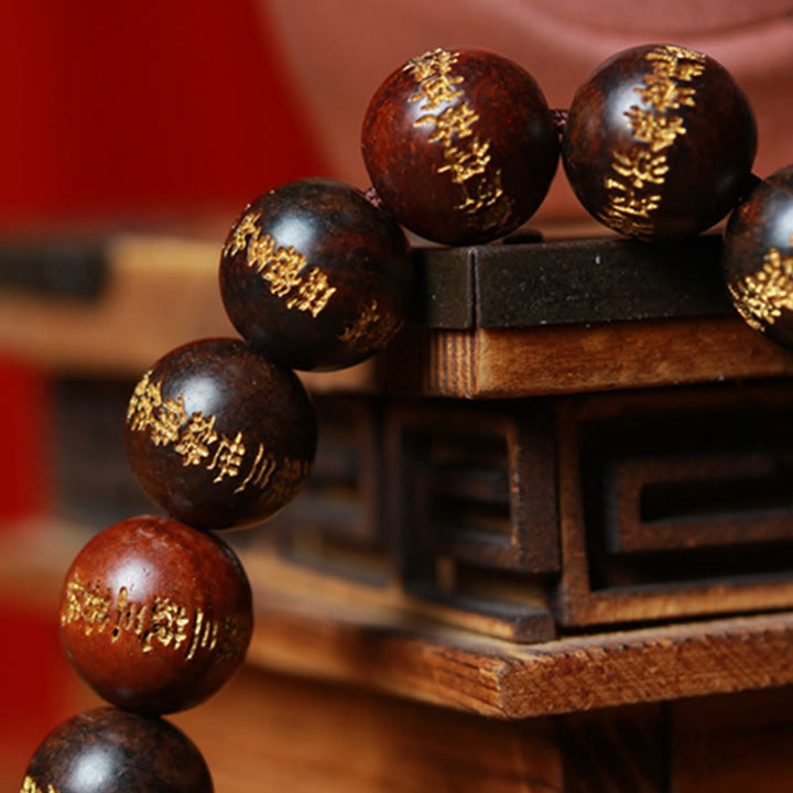 Pulsera de curación grabada con sutra de corazón de palisandro tibetano