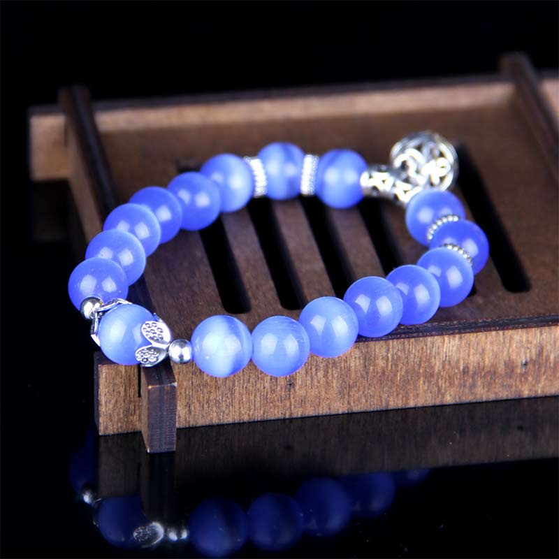 Pulsera de la suerte con ojo de gato tibetano y Buddha Stones