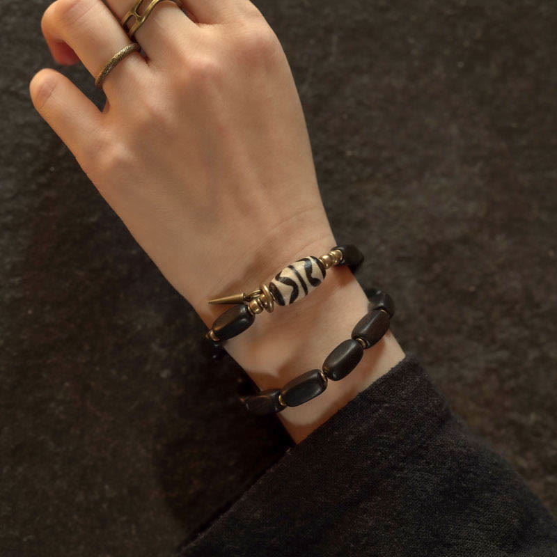 Pulsera de doble envoltura con cuentas Dzi de madera de ébano del Tíbet con Buddha Stones