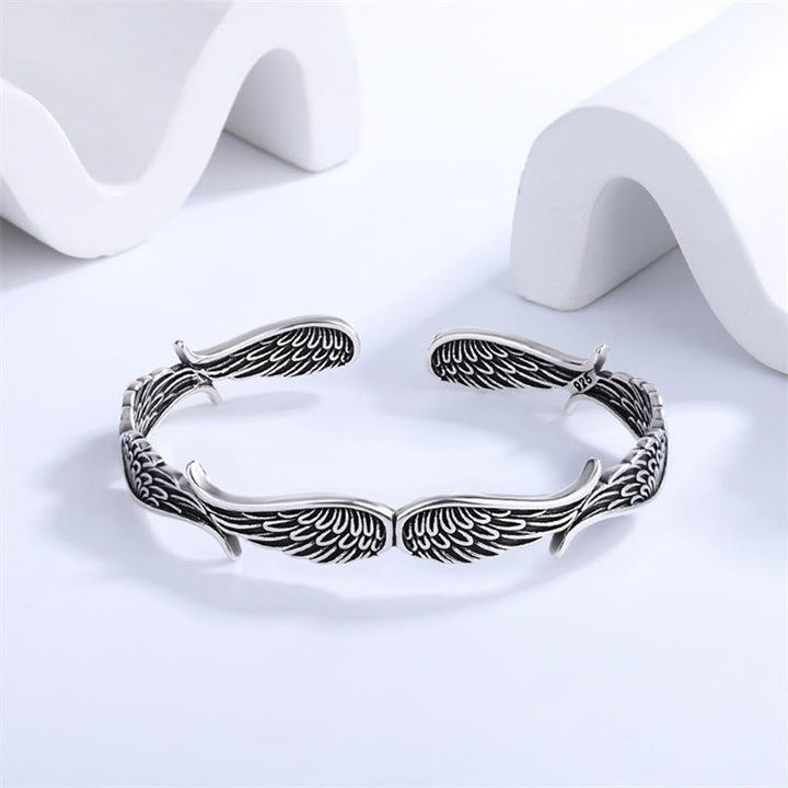 Brazalete de pulsera de la suerte tallada con patrón de plumas de alas de ángel de Buddha Stones