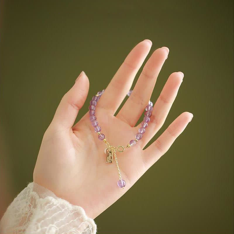 Pulsera de cristal de amatista natural que alivia el estrés.