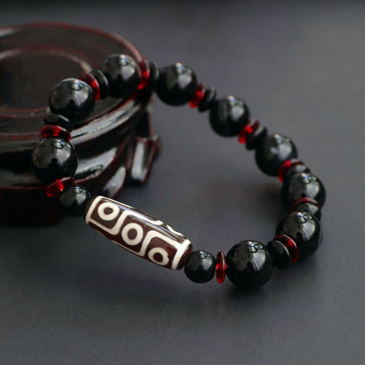 Pulsera de protección de la riqueza con cuentas Dzi de nueve ojos de ónix negro y Buddha Stones