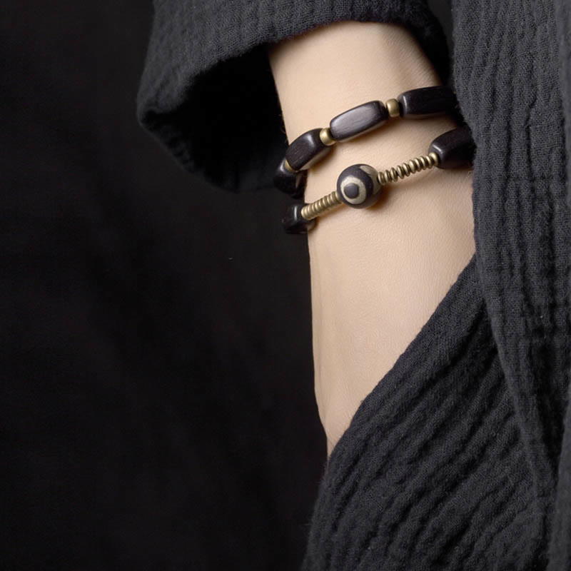 Pulsera de doble envoltura con cuentas Dzi de madera de ébano del Tíbet con Buddha Stones