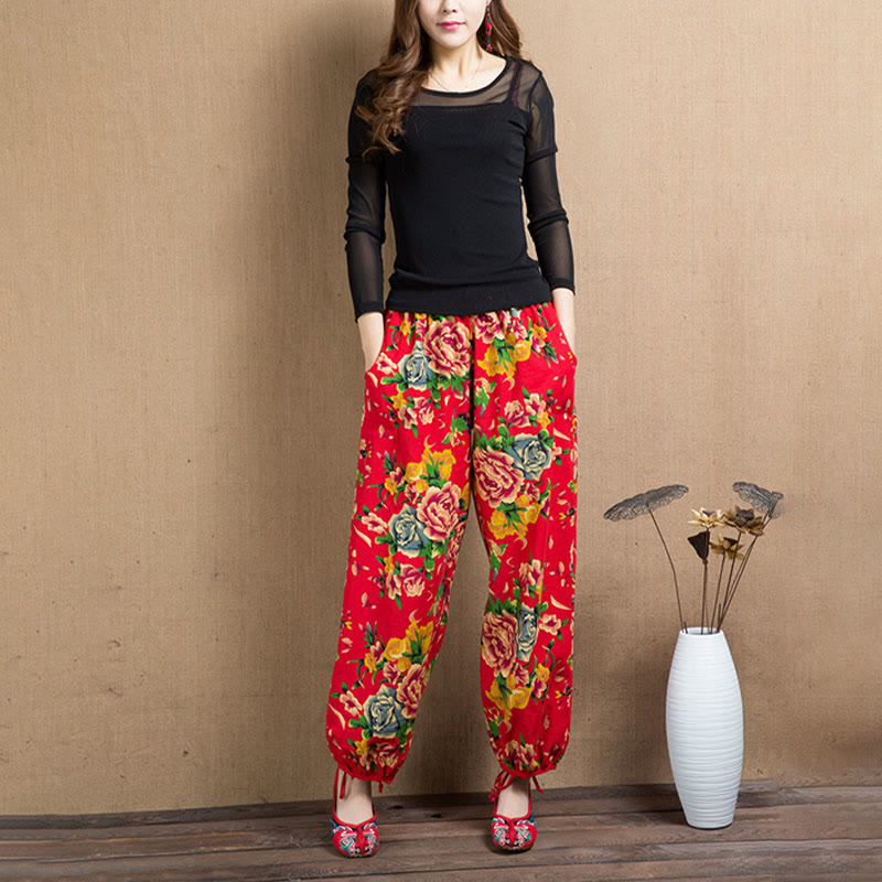 Pantalones bombachos con estampado de flores rojas y verdes de estilo étnico con Buddha Stones y bolsillos