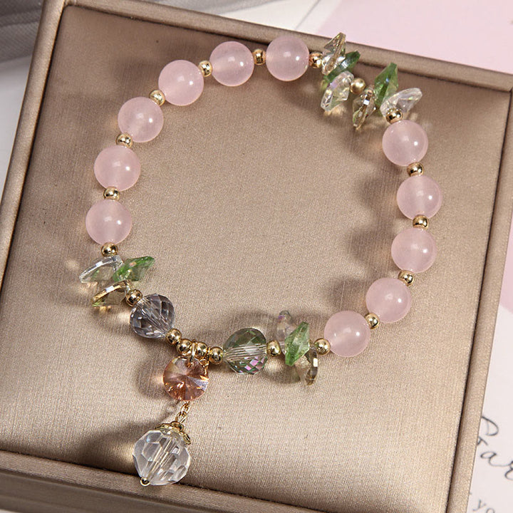 Pulsera con dije de paz y cristal rosa con ojo de gato y Buddha Stones