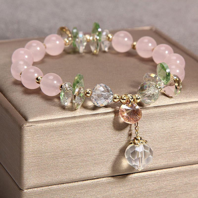 Pulsera con dije de paz y cristal rosa con ojo de gato y Buddha Stones