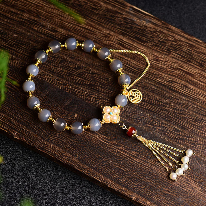 Pulsera de equilibrio con borlas y perlas de carácter Fu de ágata gris natural con Buddha Stones