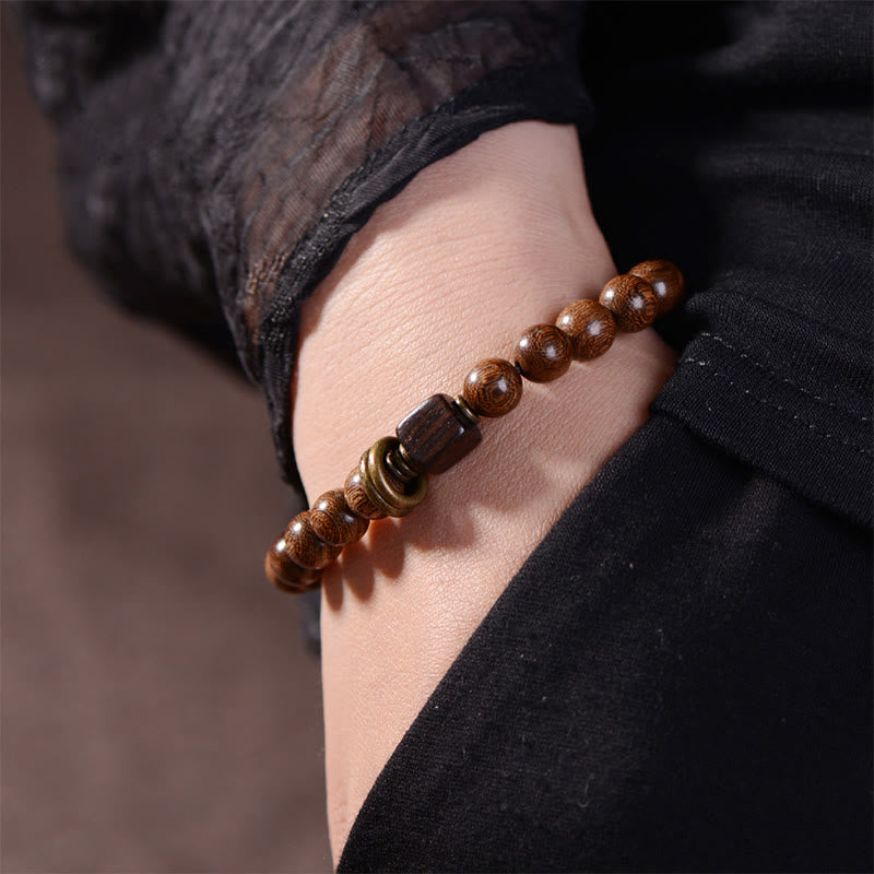 Pulsera de espiritualidad de madera de Phoebe Zhennan con Buddha Stones