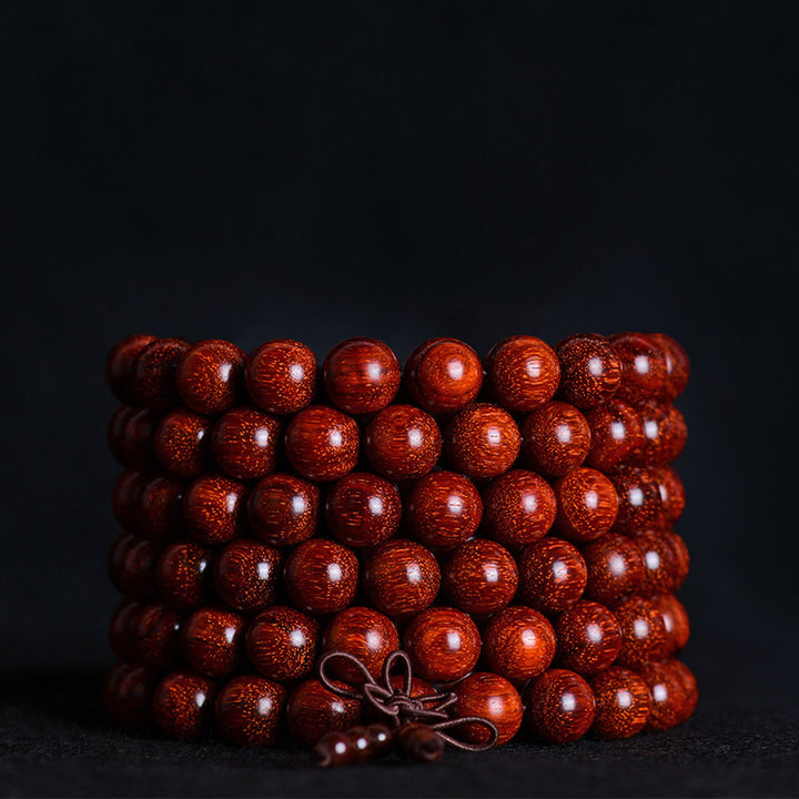 Pulsera de equilibrio de sándalo rojo con hoja pequeña tibetana de Buddha Stones