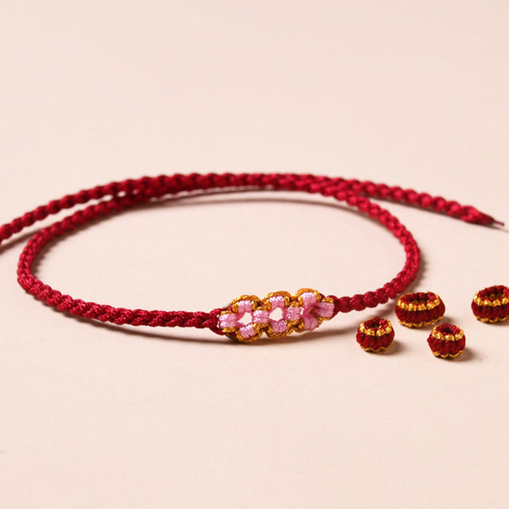 Pulsera de cuerda trenzada con protección de flor de melocotón hecha a mano con Buddha Stones