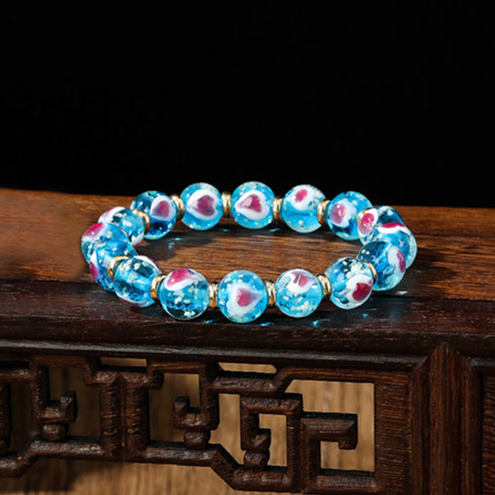 Pulsera de cuentas de cristal Liuli fluorescente luminosa con corazón de amor rosa de la familia de las bestias que tragan oro con Buddha Stones
