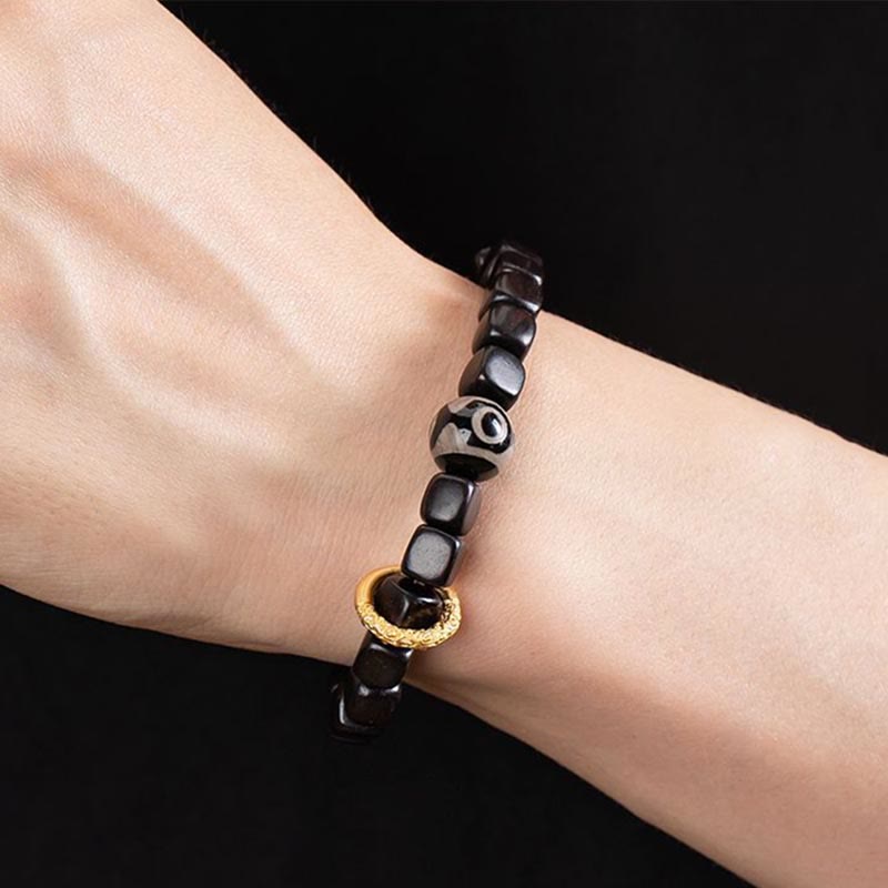 Pulsera de equilibrio de cuentas Dzi de madera de ébano tibetano con Buddha Stones