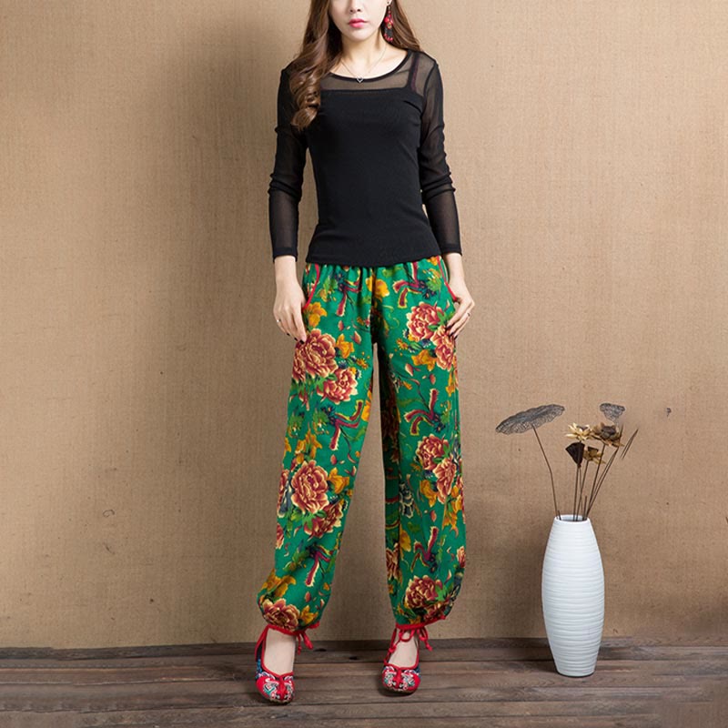 Pantalones bombachos con estampado de flores rojas y verdes de estilo étnico con Buddha Stones y bolsillos
