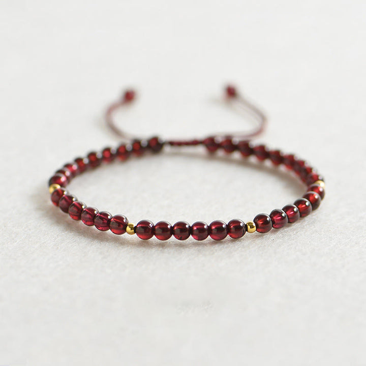 Pulsera de estabilidad con cuentas doradas y granate natural con Buddha Stones