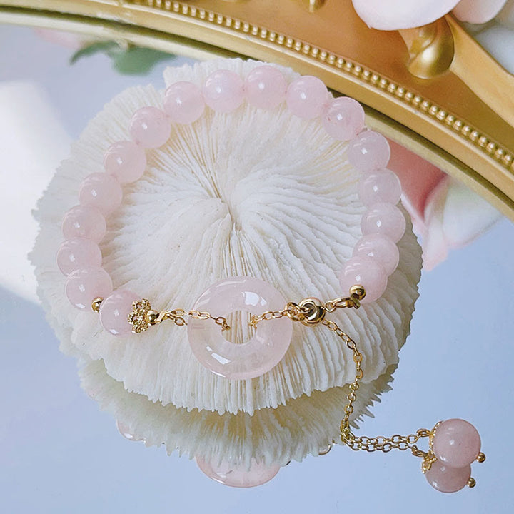 Pulsera con dije de amor con hebilla de paz y cristal rosa natural con Buddha Stones