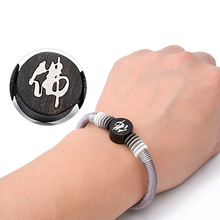 Pulsera de cuerda hecha a mano de ébano con personaje de Buda de Buddha Stones
