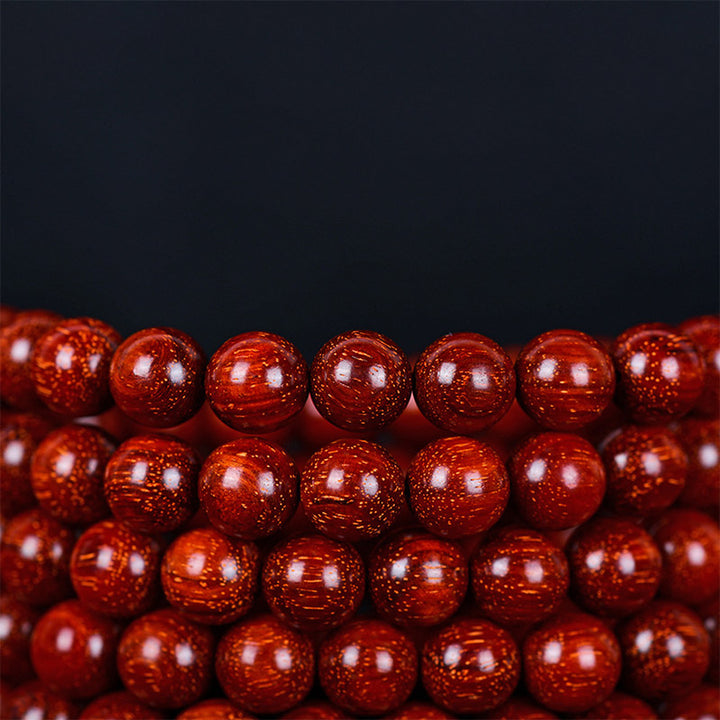 Pulsera de equilibrio de sándalo rojo con hoja pequeña tibetana de Buddha Stones