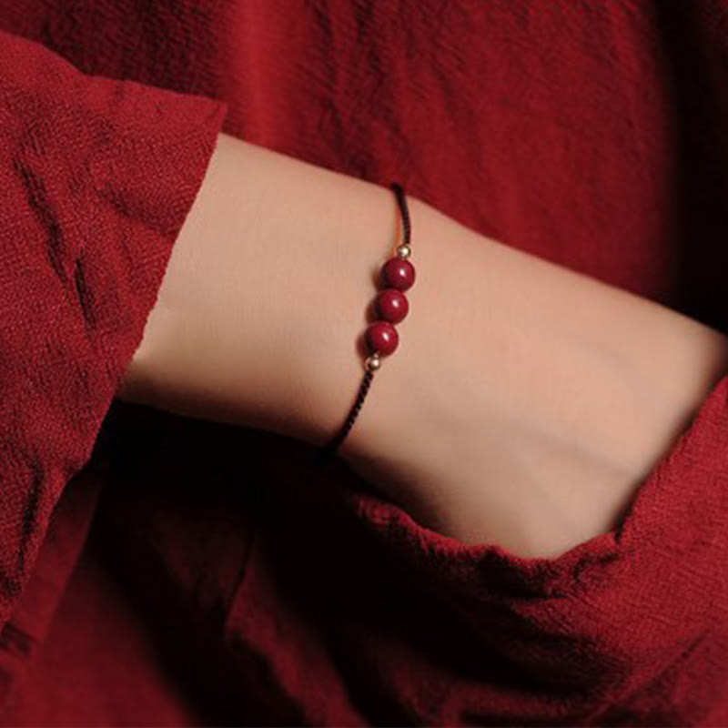 Pulsera trenzada con cadena de bendición de cinabrio natural chapada en oro de 14 quilates con Buddha Stones